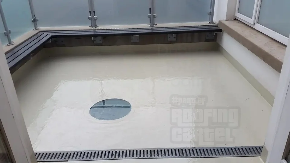 Professionally waterproofed balcony with glass railing and drainage system