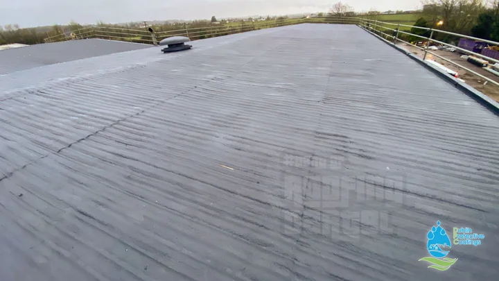 Industrial roof sealed with polyurea waterproofing system across large surface area